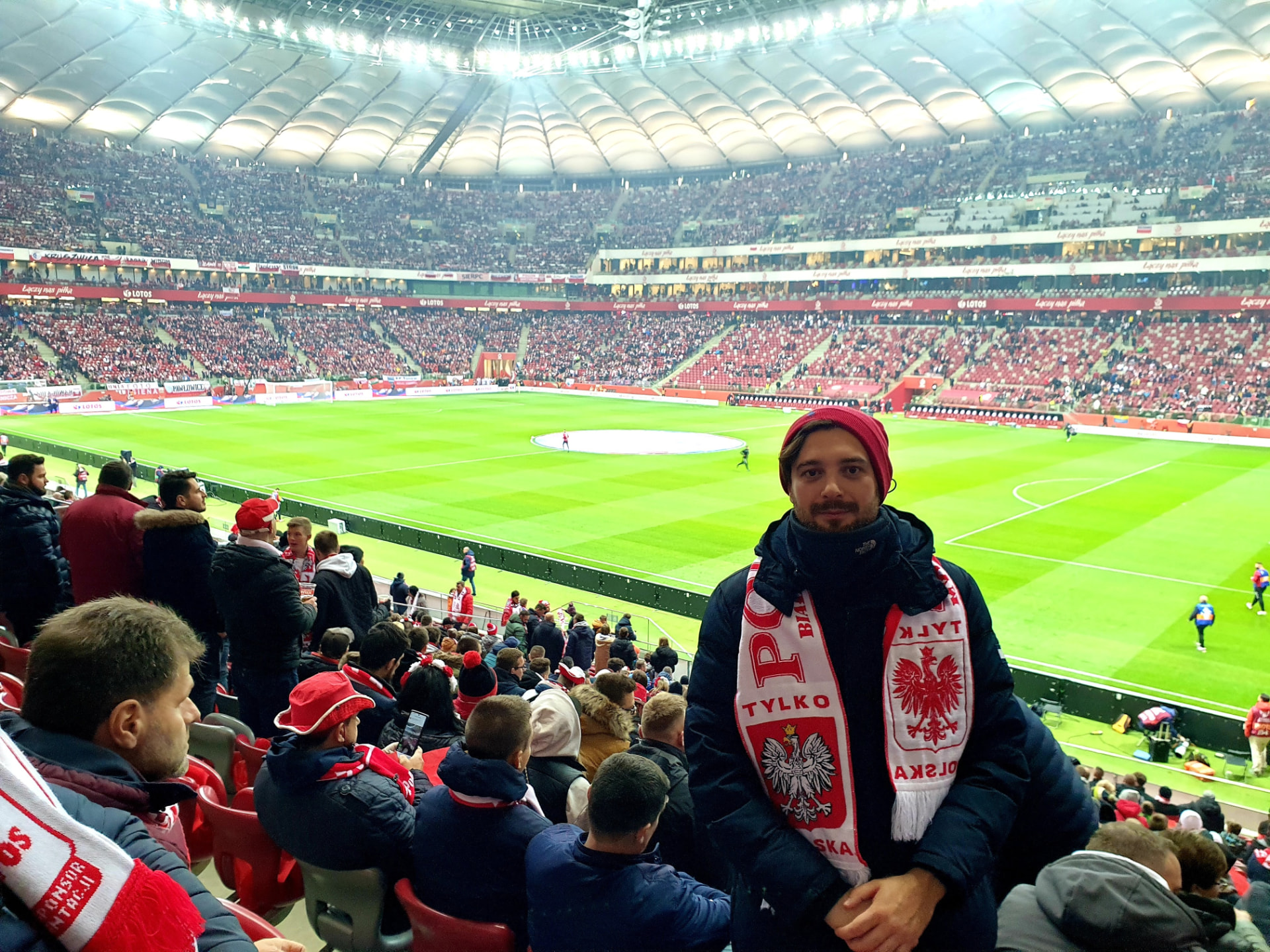 Group guest with a Poland scarf in the stands during an international match — FORTravels DMC Poland