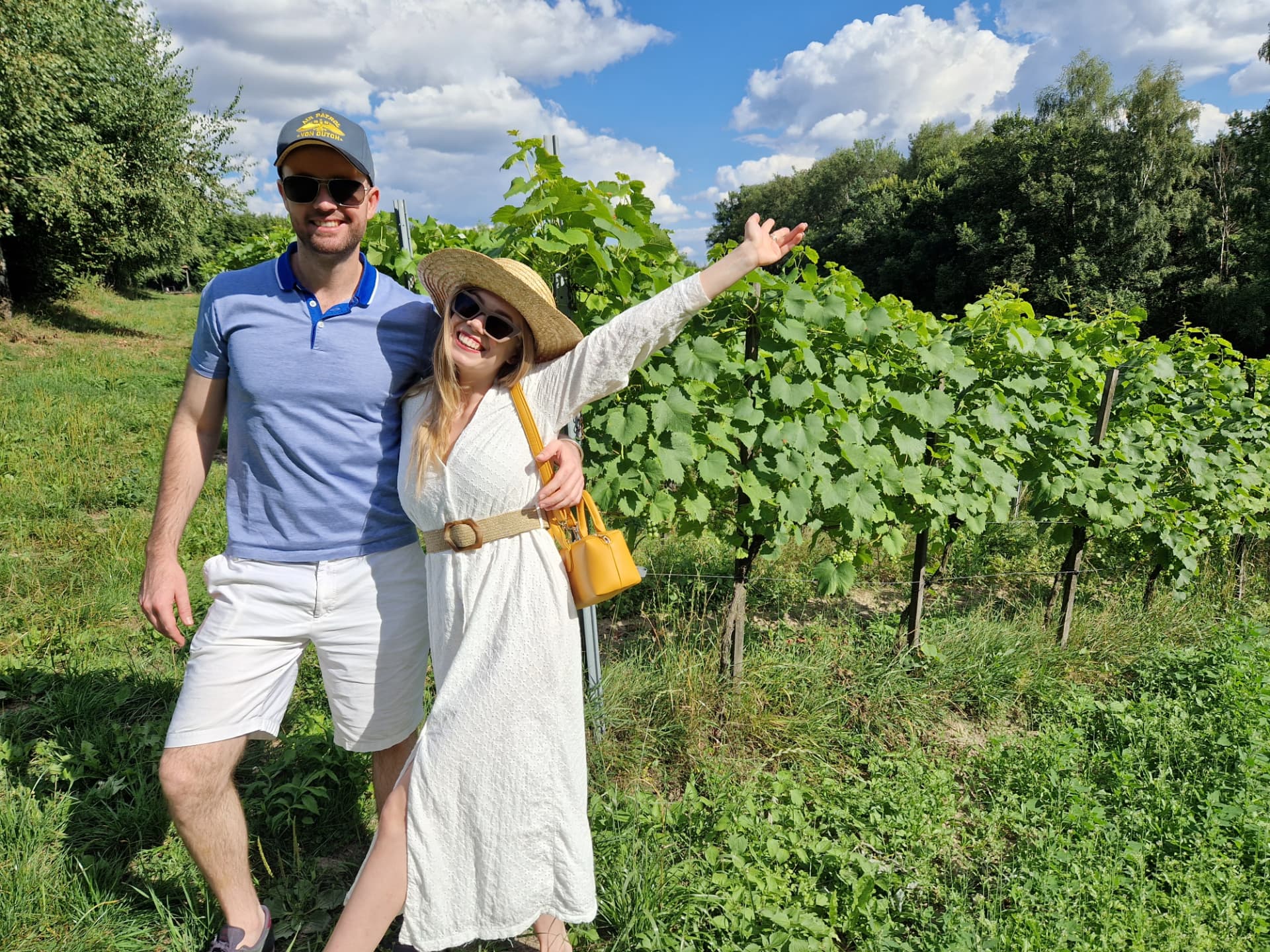 Guests walking between vineyard rows during a Polish wine tour — FORTravels DMC Poland