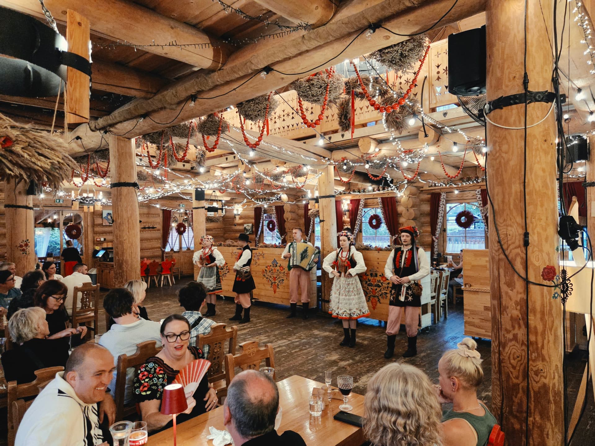 Guests watching a Polish folk show during a group dinner in Kraków — FORTravels DMC Poland