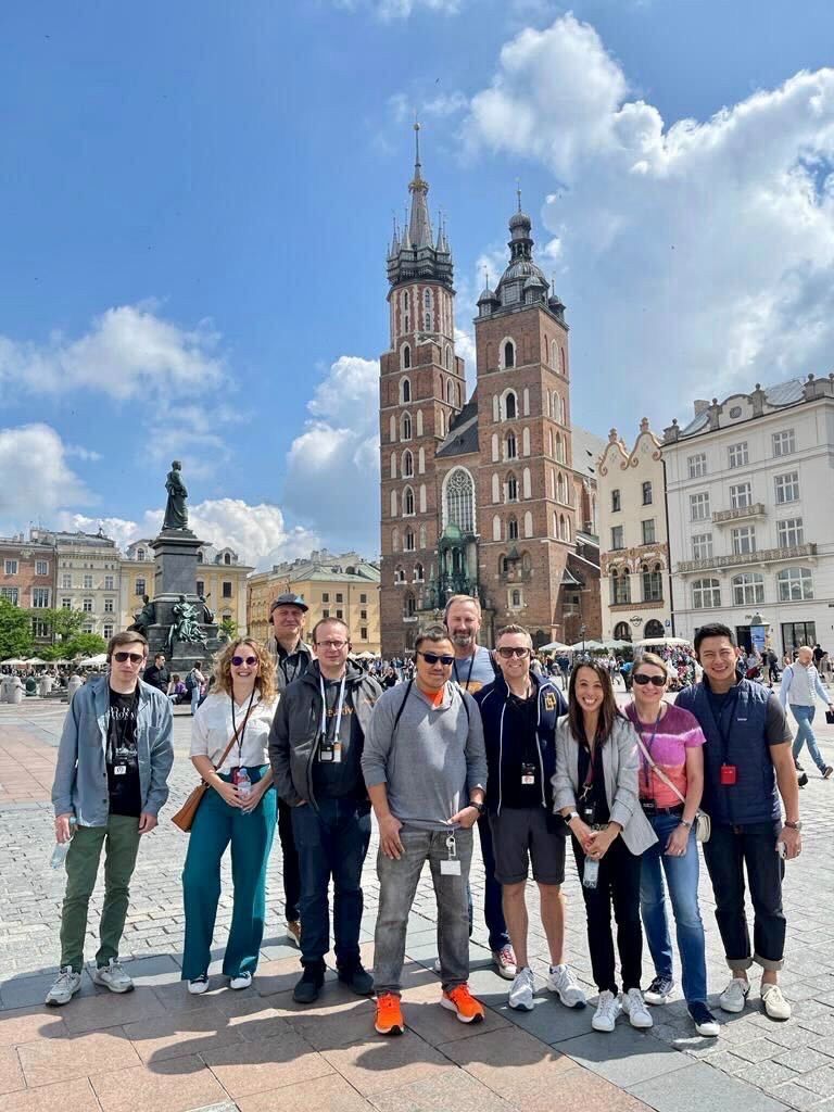 Corporate group in front of St Mary's Basilica in Kraków — FORTravels DMC Poland