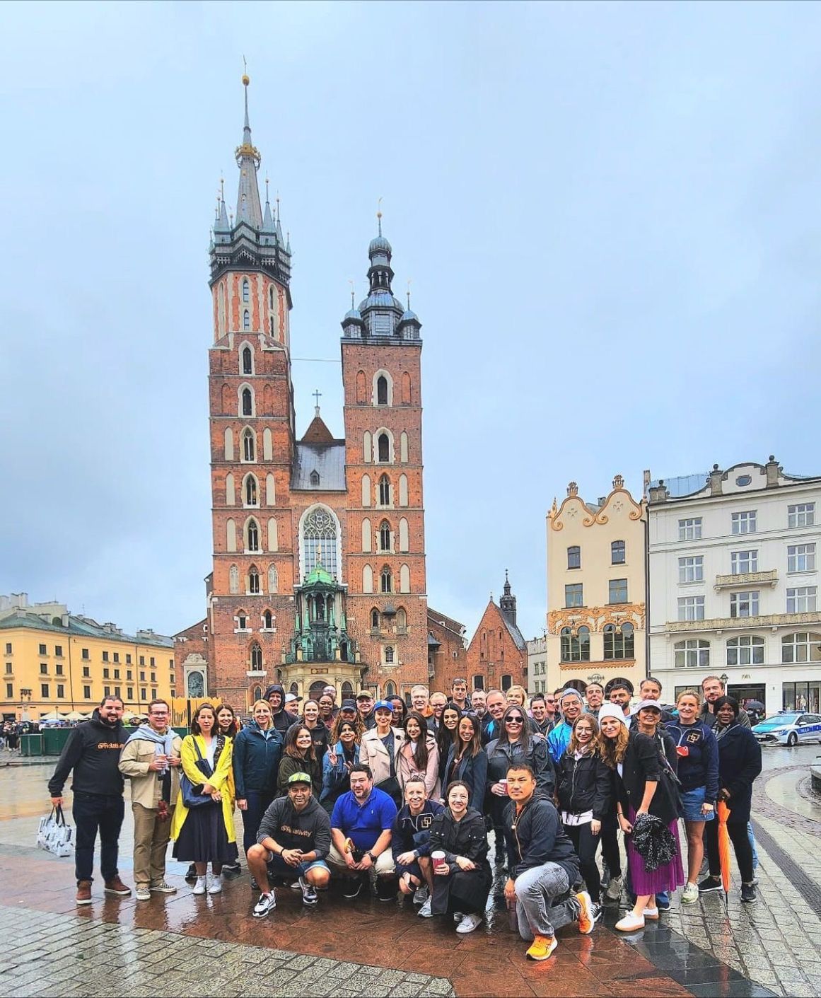Large incentive group photographed on Kraków Main Market Square — FORTravels DMC Poland