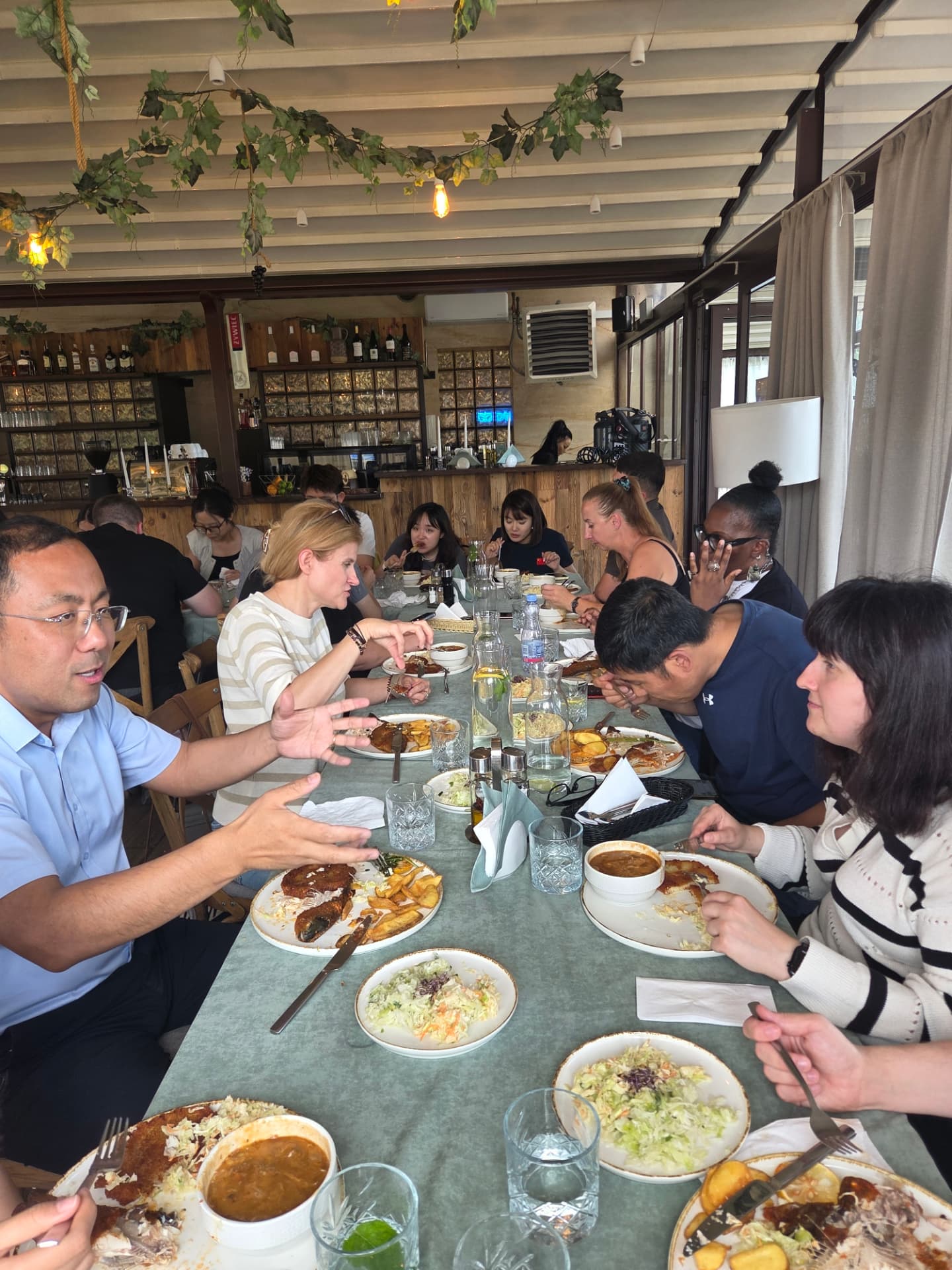 International group sharing a traditional Polish lunch during a food tour — FORTravels DMC Poland